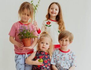 Four children wearing clothes by Lilly + Sid