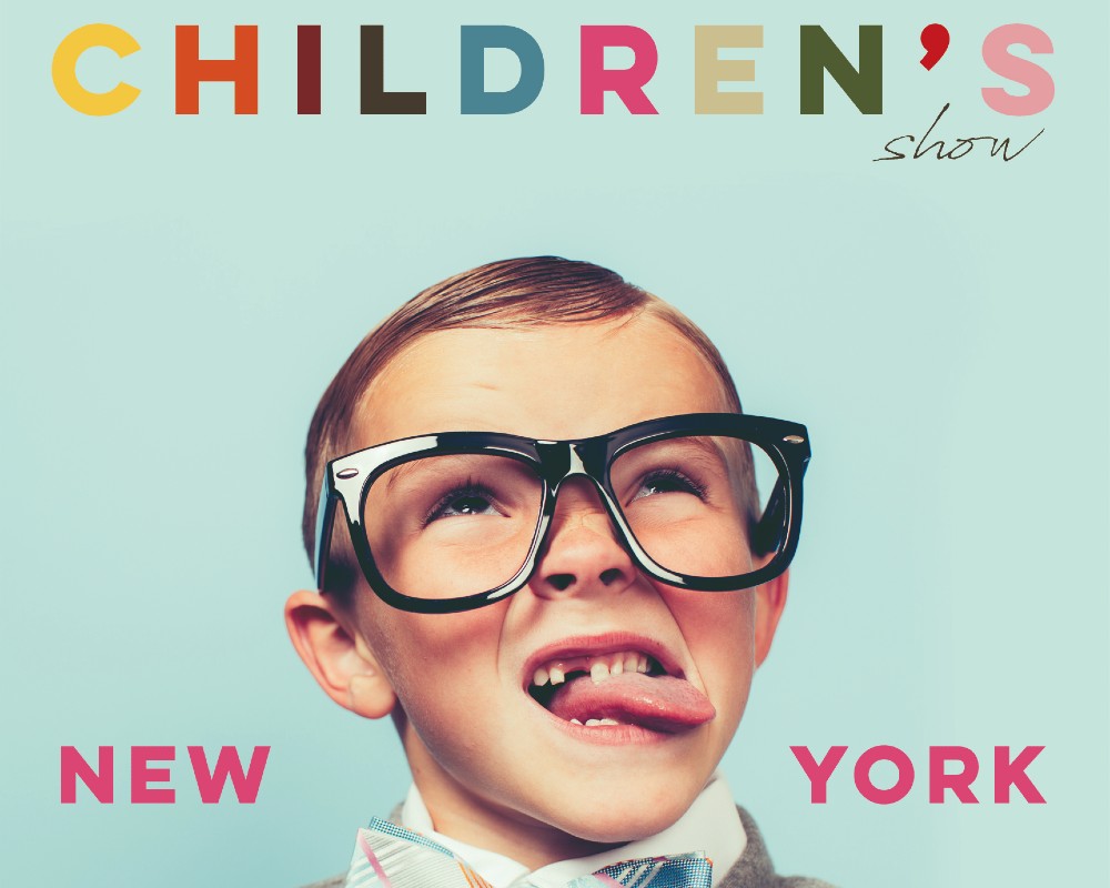 A Young boy wearing glasses sticking his tongue out advertising Children's Show New York