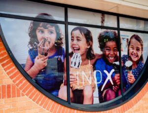INDX Kids sign in a window