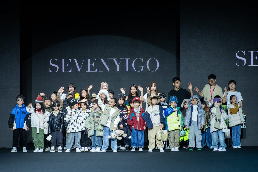 A group of children stood on a fashion catwalk at CHIC