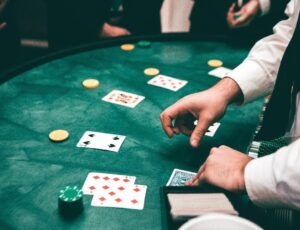 A man dealing cards at a casino table