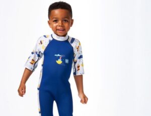 A Young boy wearing a wetsuit by Splash About