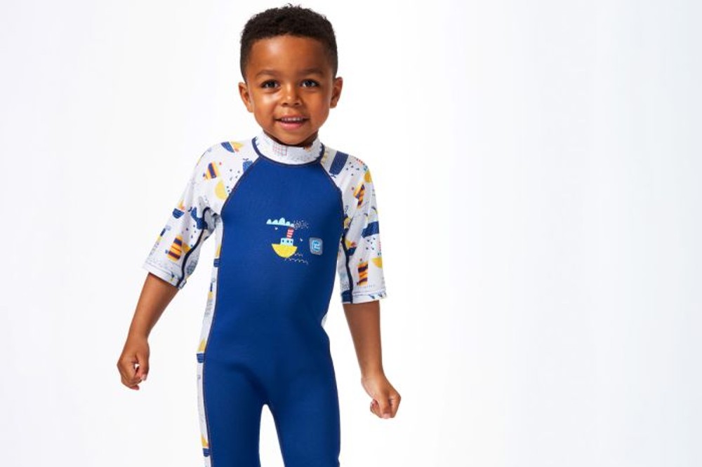A Young boy wearing a wetsuit by Splash About