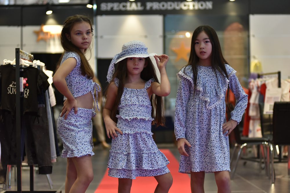 Three girls modelling childrenswear at CBME Türkiye 