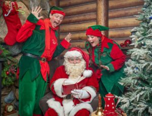 Father Christmas and two elves in the Hamleys x The Ritz London Christmas Grotto