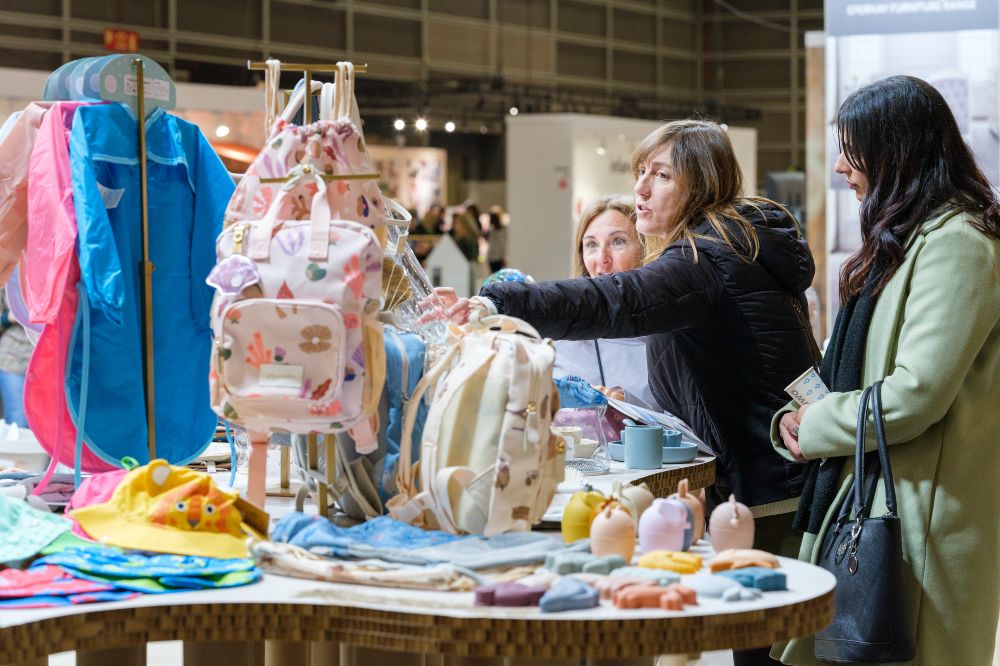 People looking at children's products on a stand at Babykid Spain + FIMI