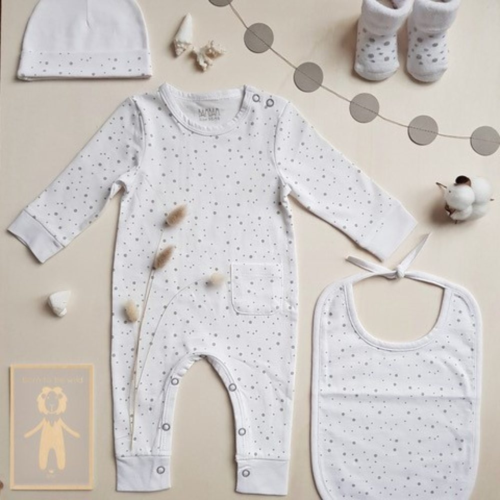 A flatlay of baby clothing 