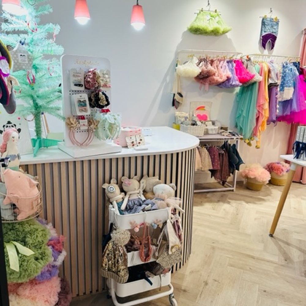 A shop counter and children's dress-up items and accessories 