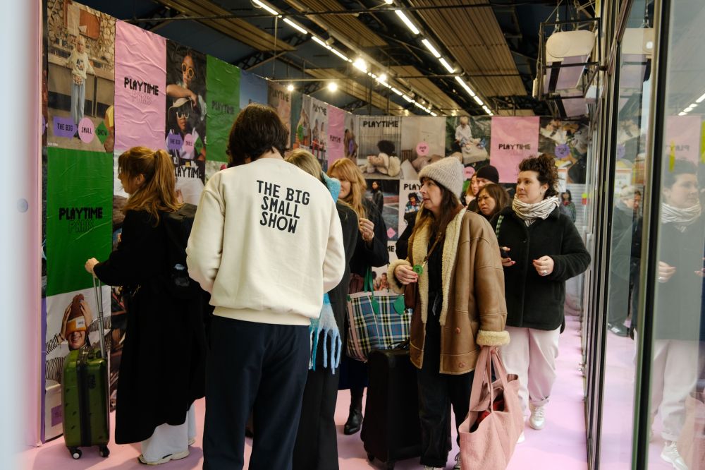 People stood in an aisle at the Playtime Paris trade show 