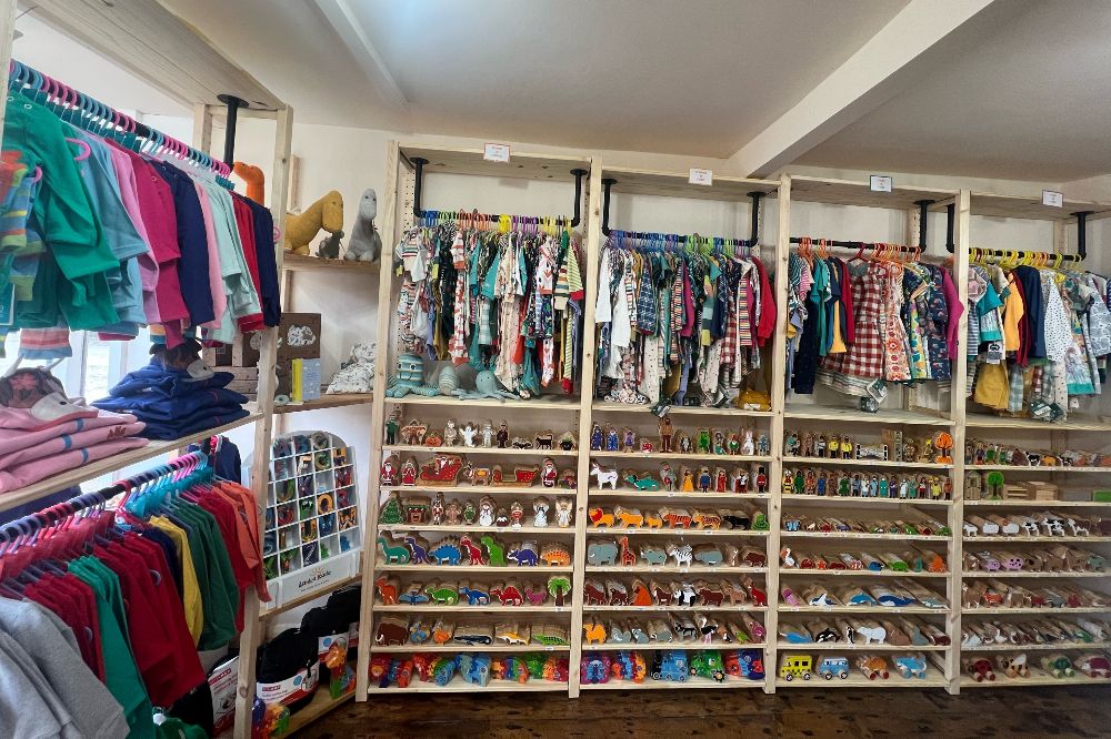 Children's clothes and toys displayed in Polly and Tots children's shop 
