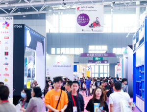 A busy aisle full of visitors at Baby & Stroller China