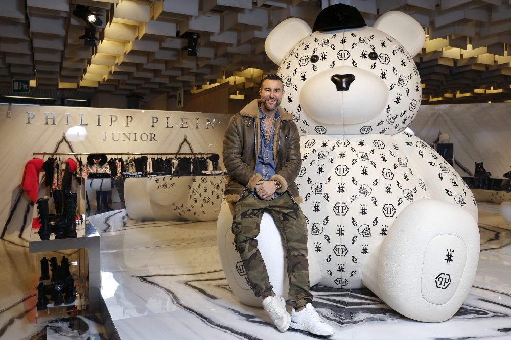 Philipp Plein beside a large bear installation at Pitti Bimbo
