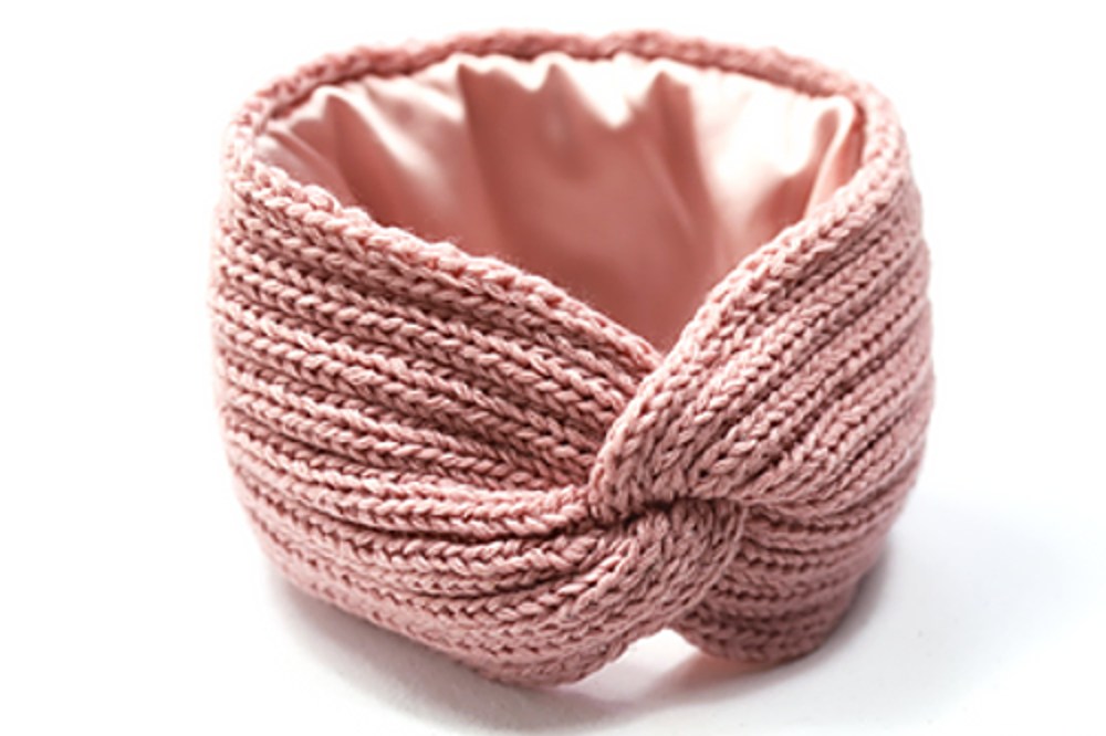 A pink silk-lined knitted headband 