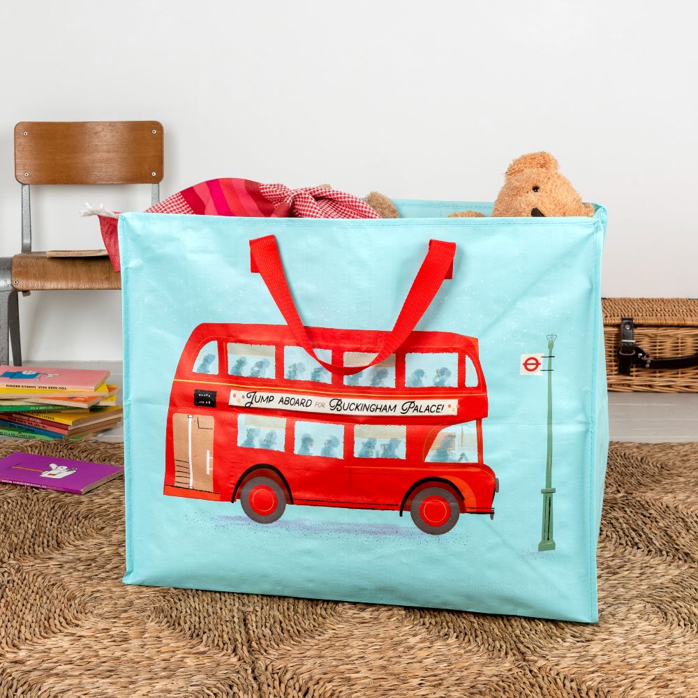 A large blue bag with a red London bus on the front