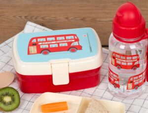 A child's lunchbox and water bottle with a red London bus design