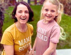 A woman and young girl outside laughing wearing Mama Squad and Mini Squad T-shirts by My Little Green Wardrobe