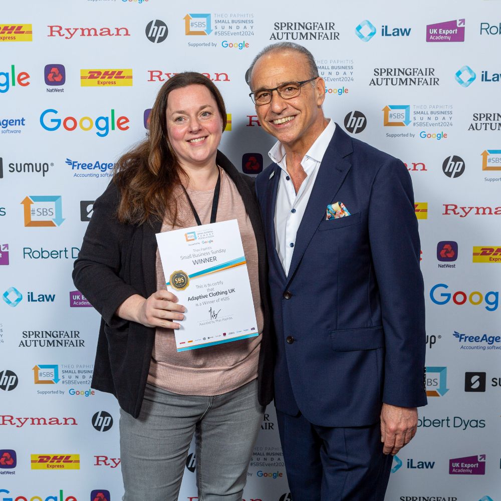 Helen Clawson, founder of Adaptive Clothing UK, stood beside Theo Paphitis receiving a certificate 