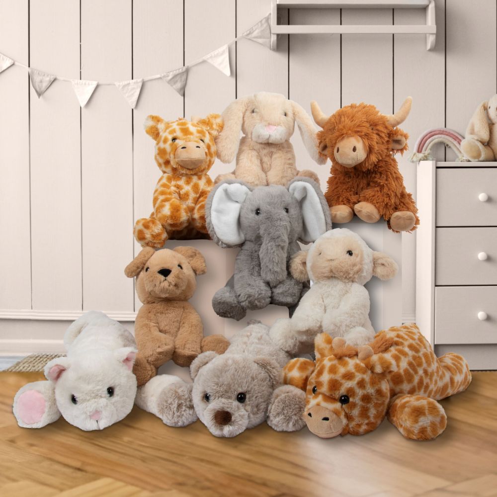 A selection of children's soft toy animals displayed together 