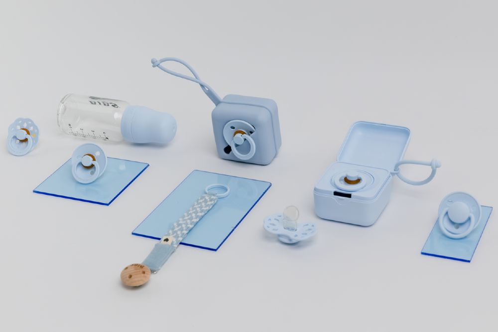 A selection of blue baby products and accessories by BIBS 