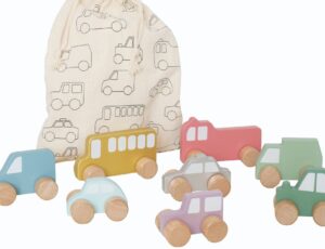 Different coloured wooden cars and trucks beside a cloth gift bag