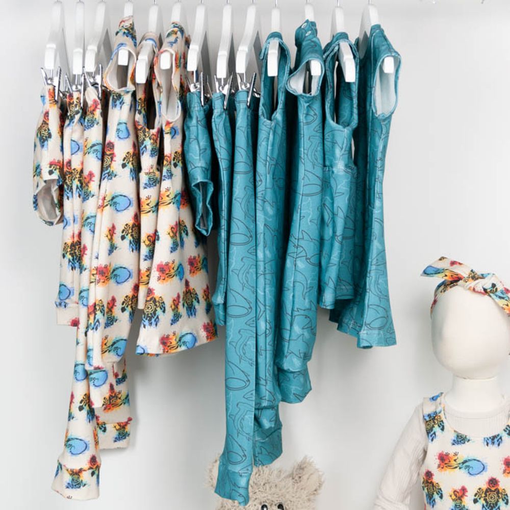Children's clothing hung on a rail 