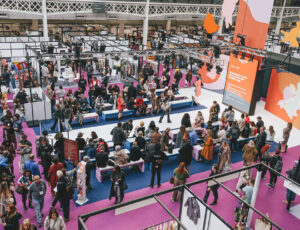 A busy exhibition hall full of visitors at Source Fashion