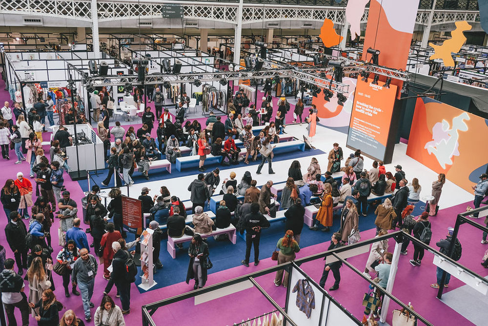 A busy exhibition hall full of visitors at Source Fashion