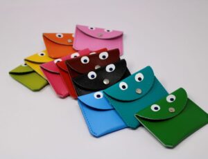 Different coloured mini coin purses with googly eyes