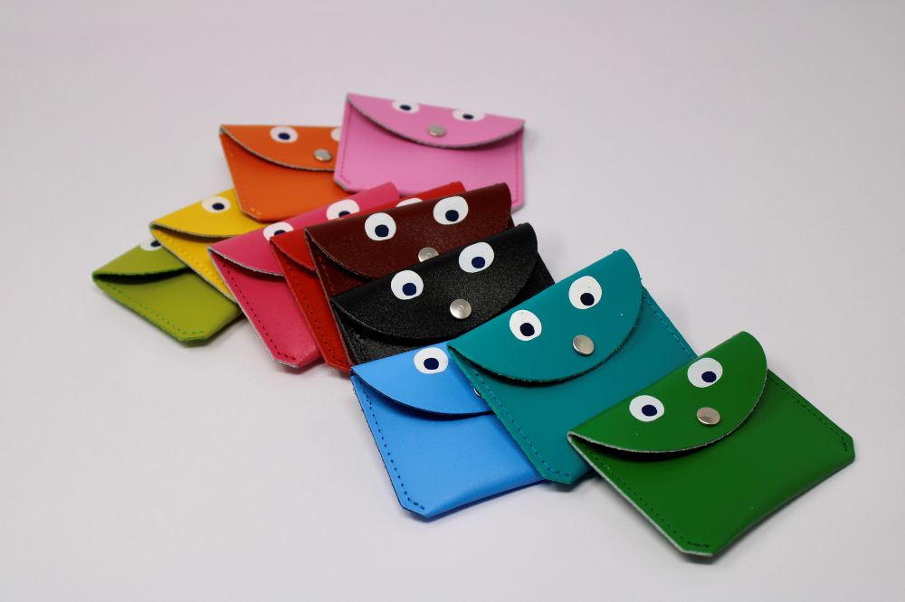 Different coloured mini coin purses with googly eyes