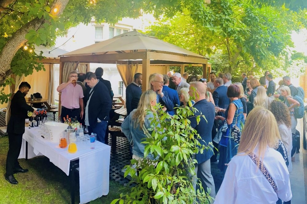 A group of people outside having drinks after the BPA AGM