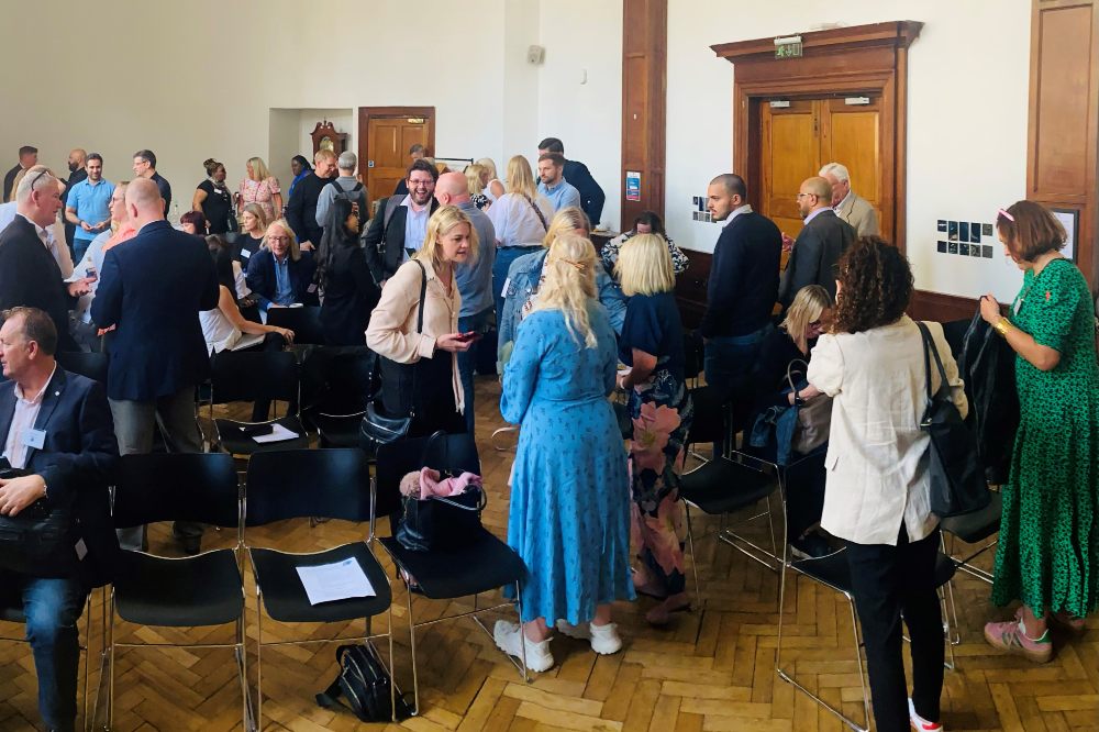 A group of people in a room attending the BPA AGM