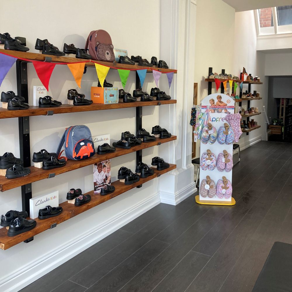 Children's shoes displayed on the wall in kids' shoe shop It's Feet First 