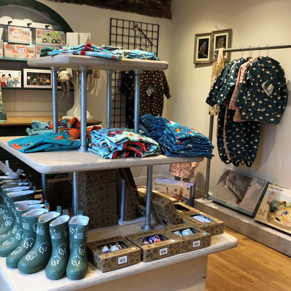 Children's clothes toys and shoes displayed in a shop 