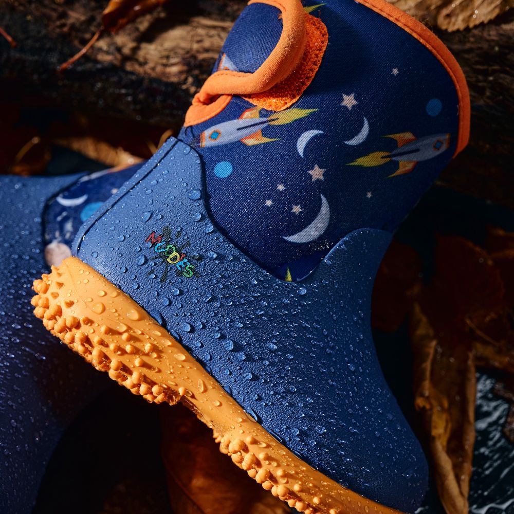 A blue and orange pair of kids' outdoor boots with a space pattern on the side 