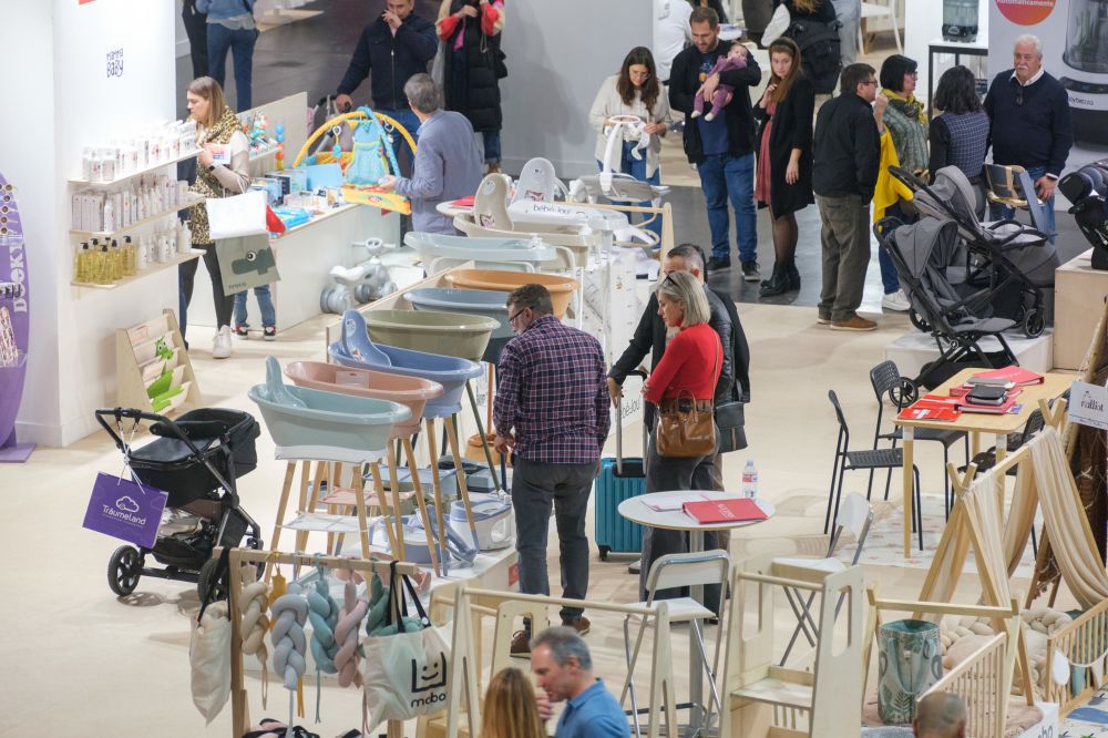 People stood in a hall containing children's products at the BKS + FIMI trade show 