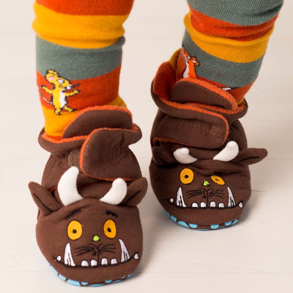 A child's legs and feet wearing striped Gruffalo leggings and Gruffalo booties by Blade & Rose 