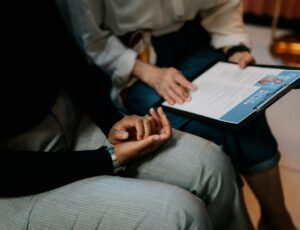 Two people sat down going through a CV