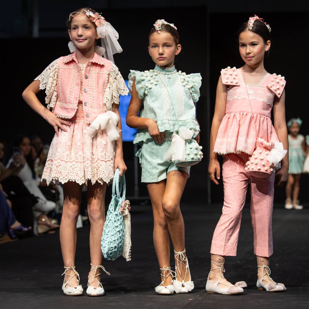 Three girls on a fashion catwalk at FIMI 