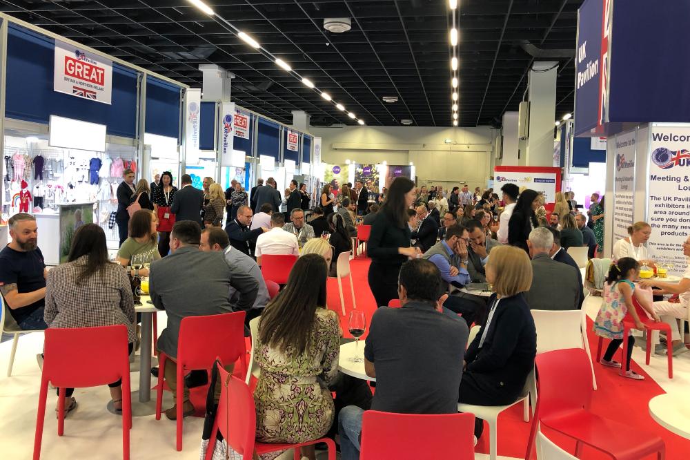 People sat in the UK Pavilion within the Kind + Jugend trade show