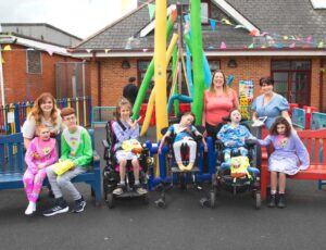 A group of children outside a building and park wearing a new adaptive Sponge Bob clothing range