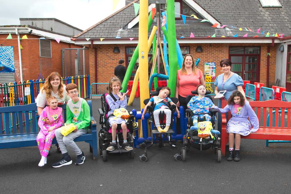 A group of children outside a building and park wearing a new adaptive Sponge Bob clothing range