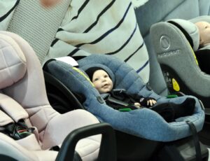 Babies' car seats with dolls in them