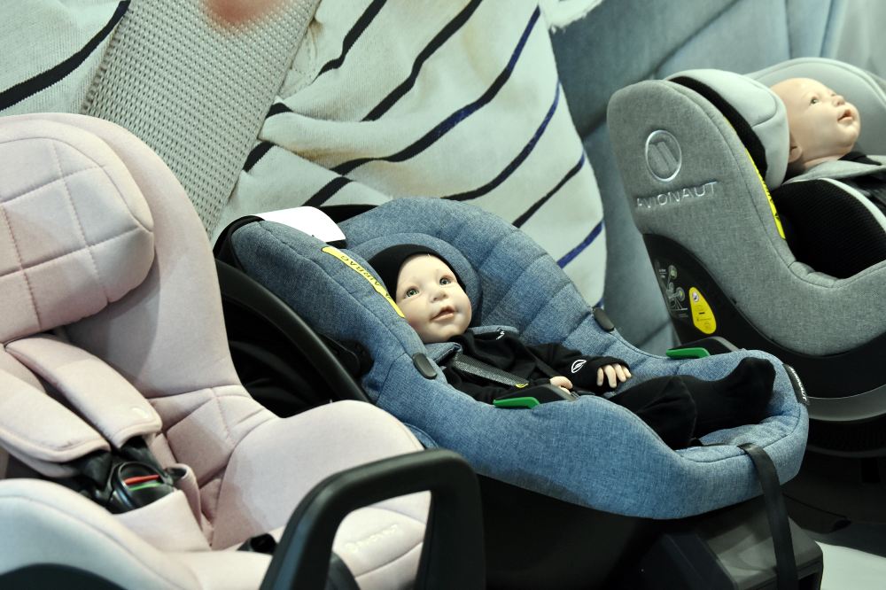 Babies' car seats with dolls in them