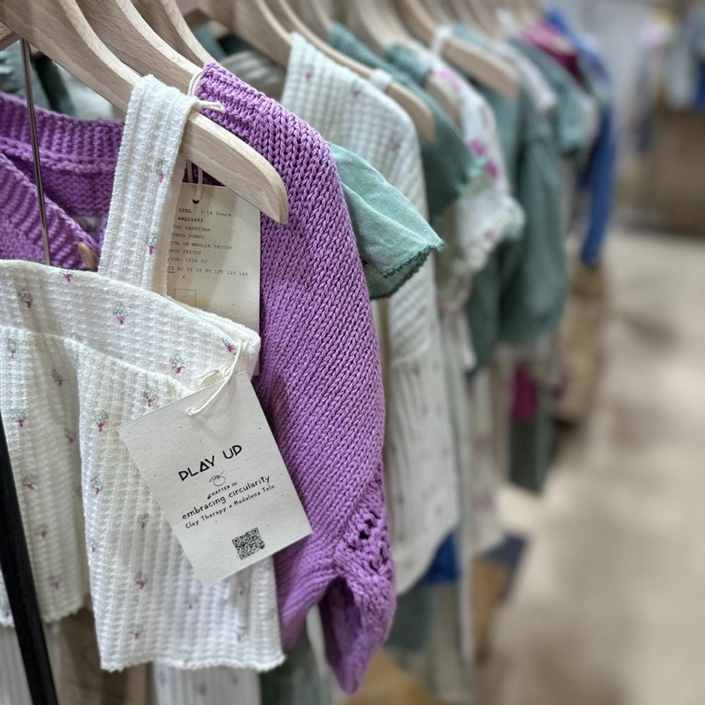 Children's clothes hung on a rail at the FIMI trade show 