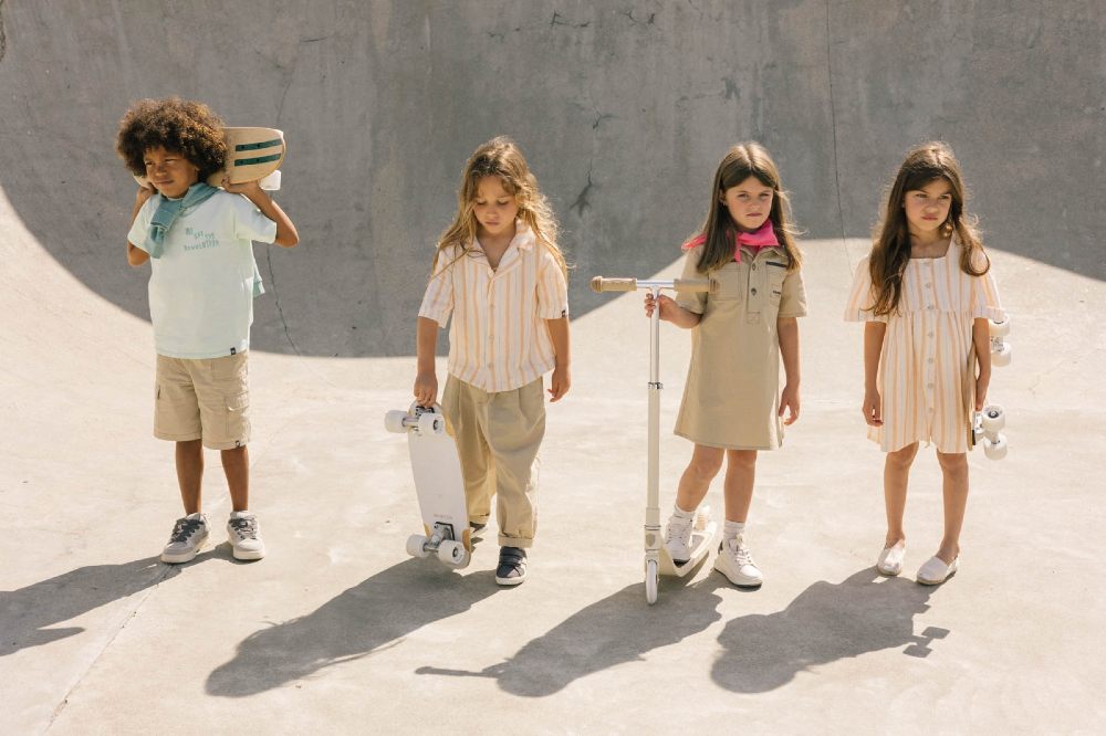 Four children stood in a skate park