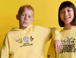 Two children wearing yellow tops