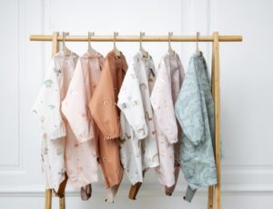 A rail of babies' overall bibs