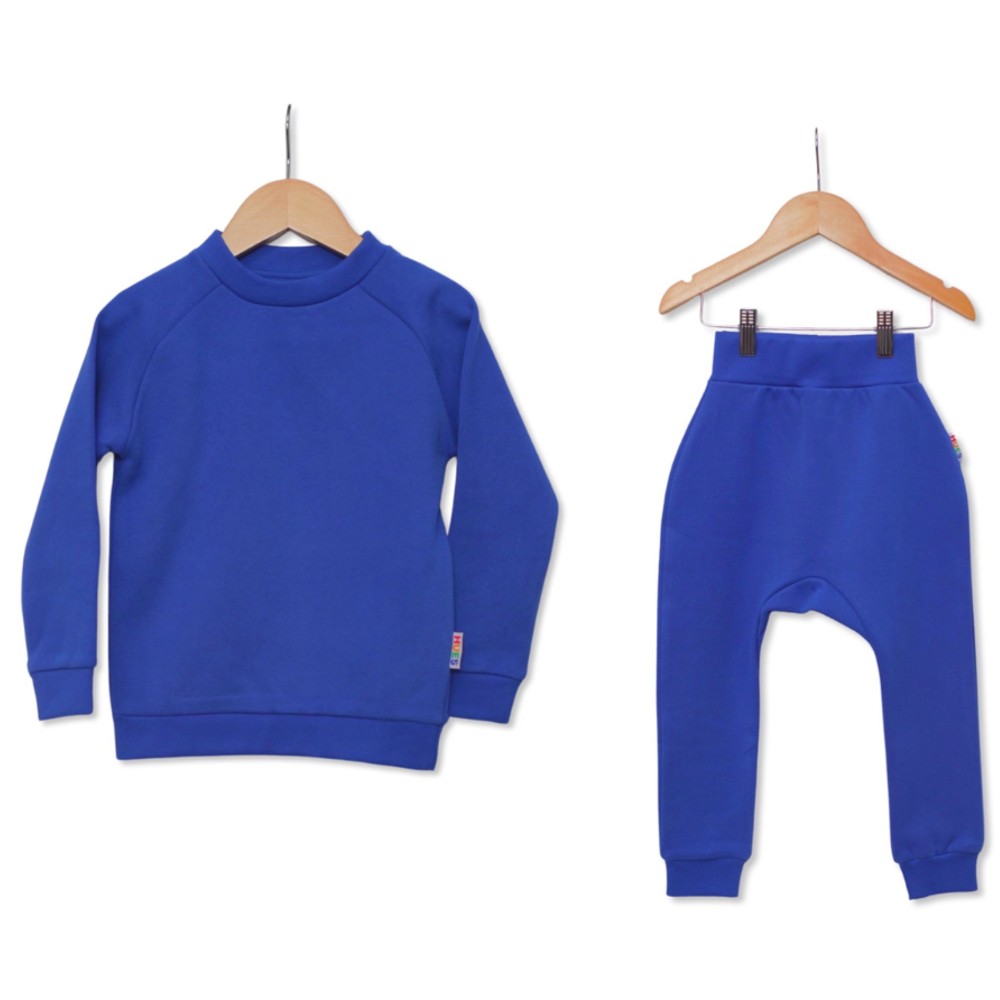 A child's blue top and matching blue trousers on clothes hangers 