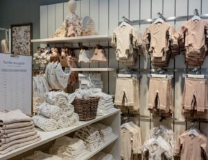 Baby clothes and accessories displayed inside a Newbie UK store