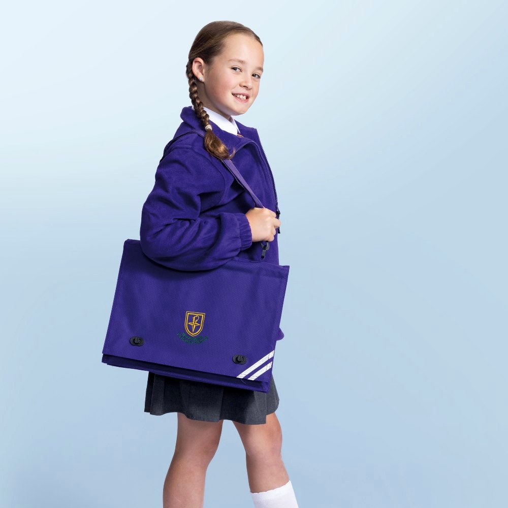 A girl in school uniform with a purple school bag over her shoulder